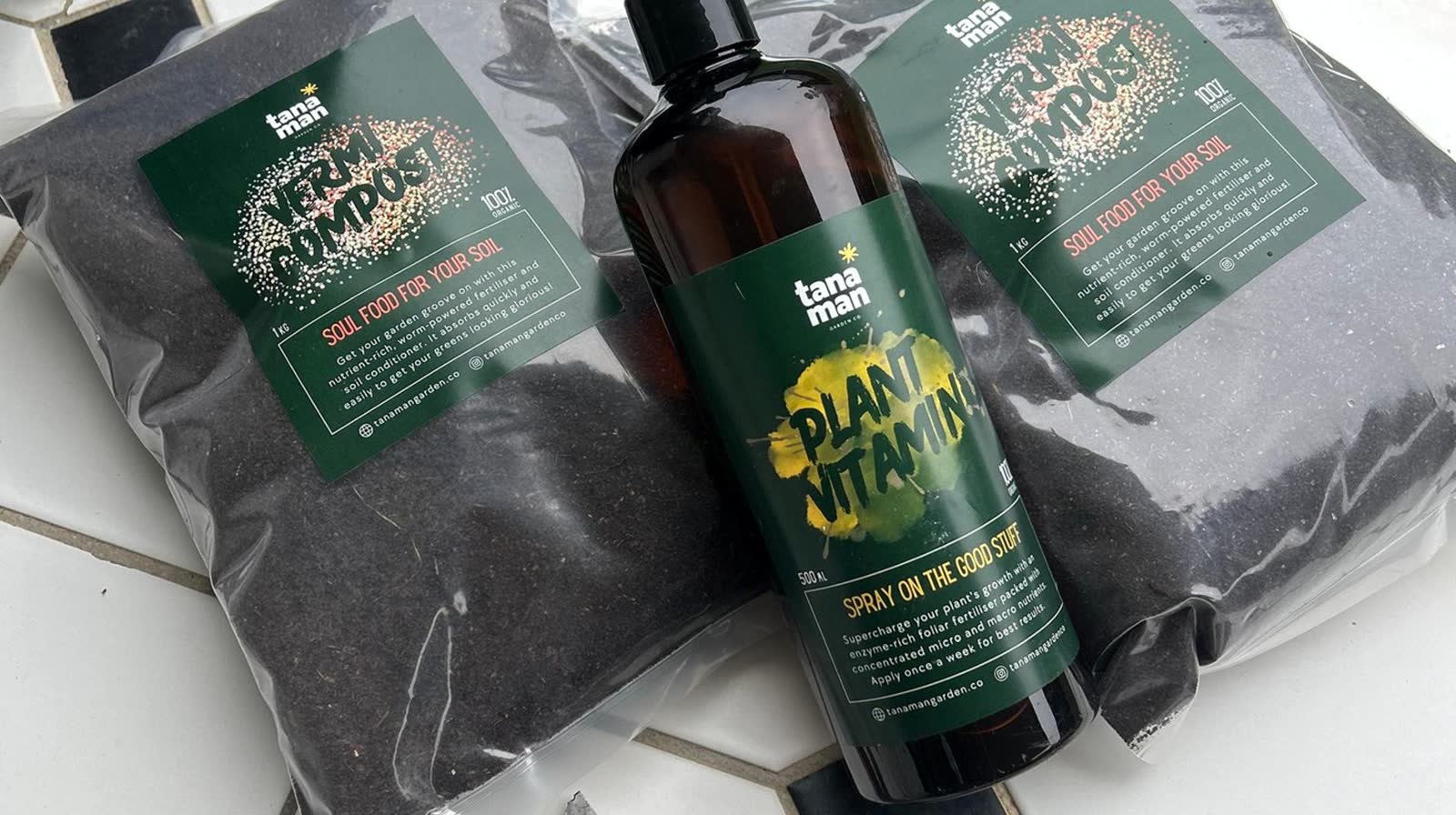 Bags of Tanaman Vermi Compost and a bottle of Plant Vitamin foliar spray